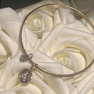 A initial bangle bracelet goldtone with rhinestone accents